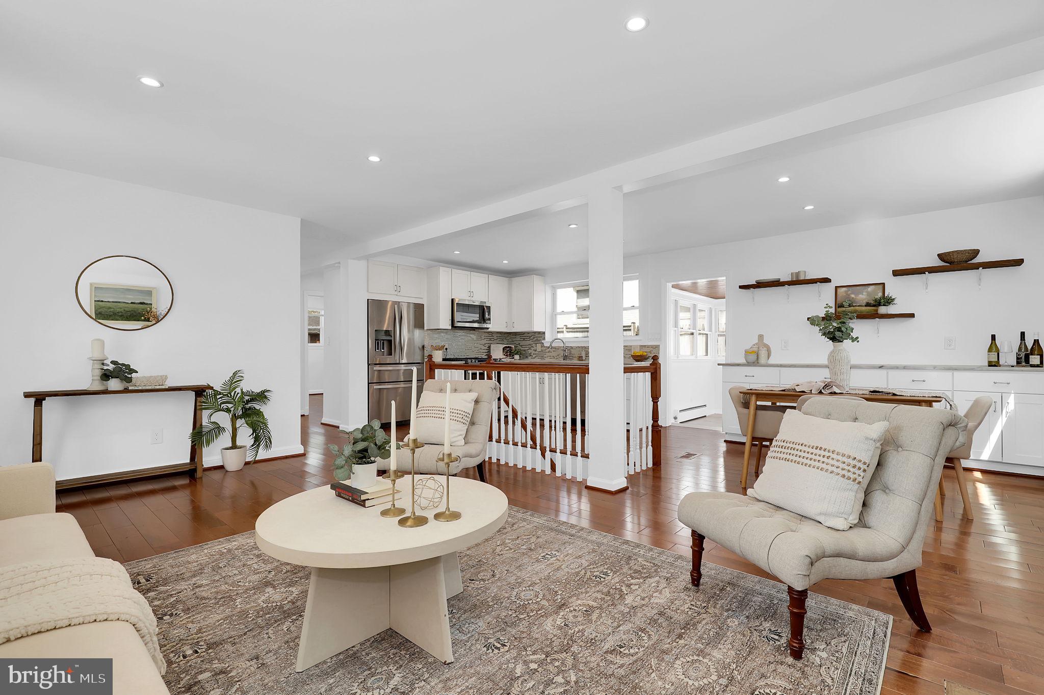 1009 Stirling Road Silver Spring, MD 20901 - Photo 6 of 33 a living room with furniture and a dining table