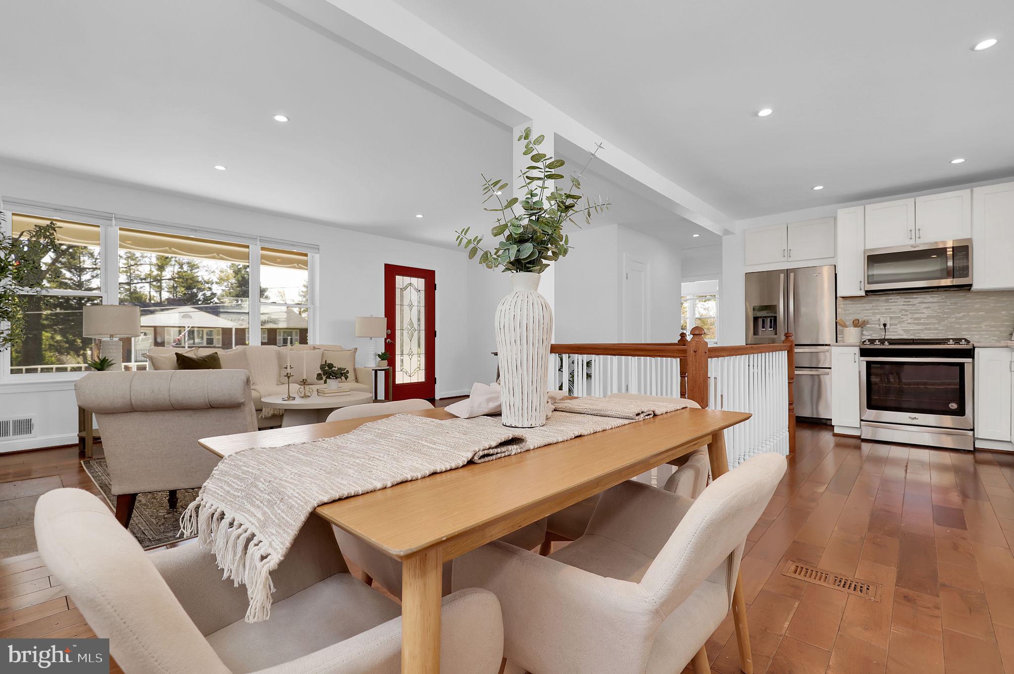 1009 Stirling Road Silver Spring, MD 20901 - Photo 7 of 33 a view of a dining room with furniture a chandelier and wooden floor