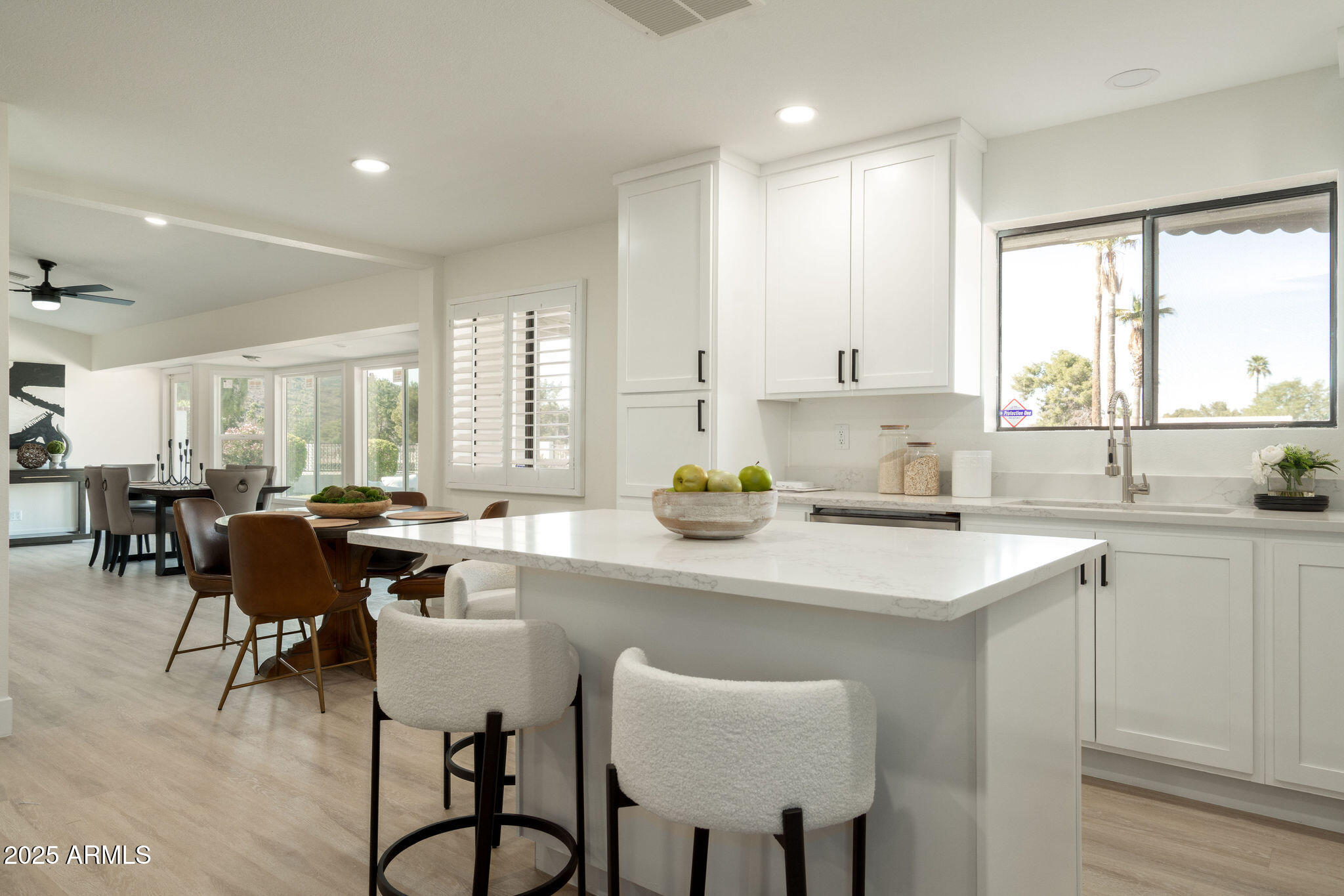 120 West Thunderbird Road Phoenix, AZ 85023 - Photo 13 of 26 a kitchen with a table chairs sink and cabinets