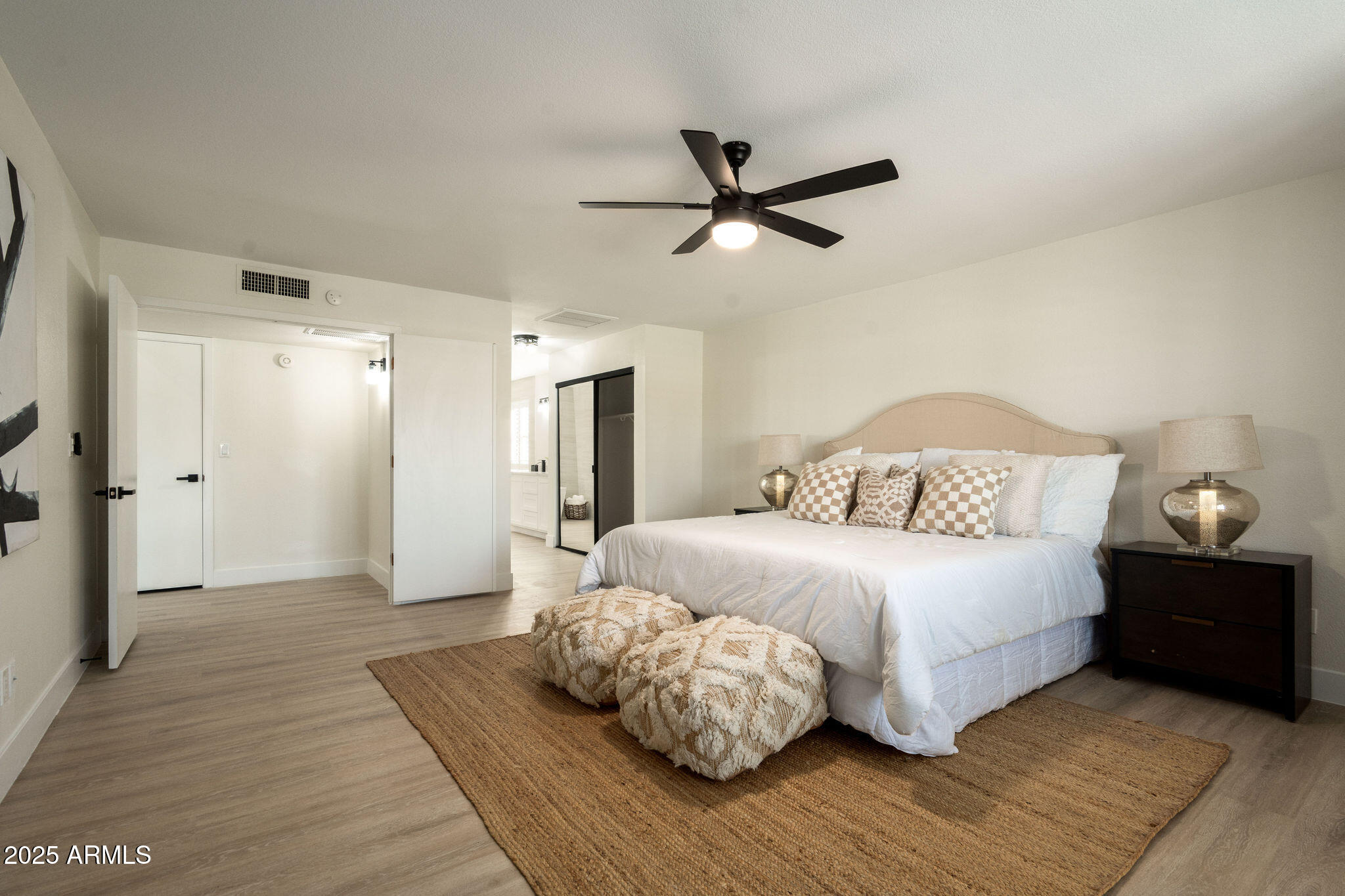 120 West Thunderbird Road Phoenix, AZ 85023 - Photo 15 of 26 a bedroom with a bed and a chandelier