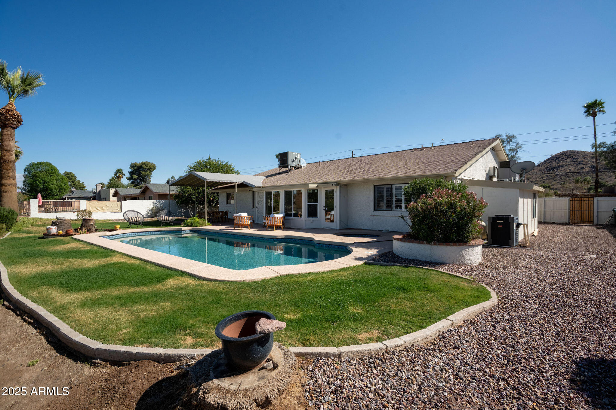 120 West Thunderbird Road Phoenix, AZ 85023 - Photo 22 of 26 a view of a house with swimming pool and sitting area