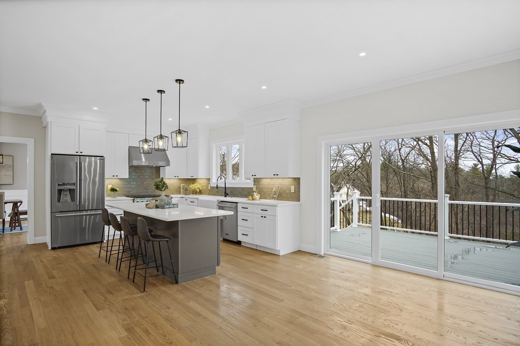41 Peach Orchard Road Burlington, MA 01803 - Photo 16 of 42 a kitchen with a sink and refrigerator