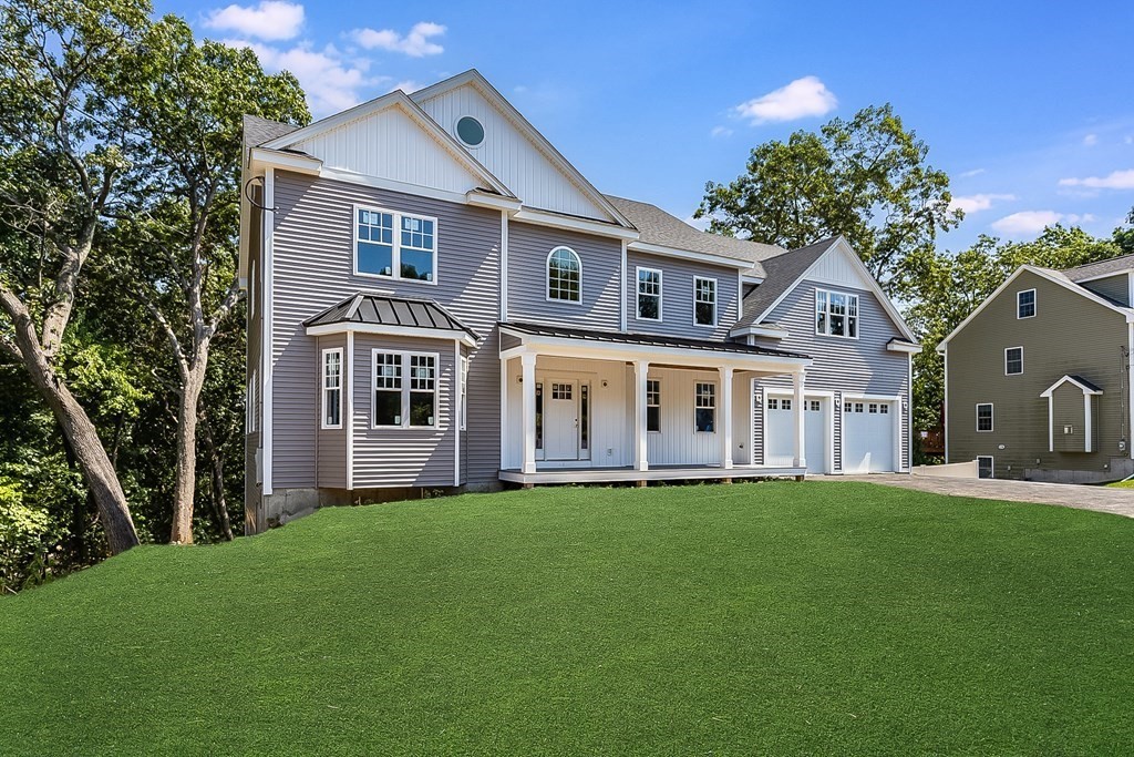 41 Peach Orchard Road Burlington, MA 01803 - Photo 2 of 42 a front view of a house with a garden