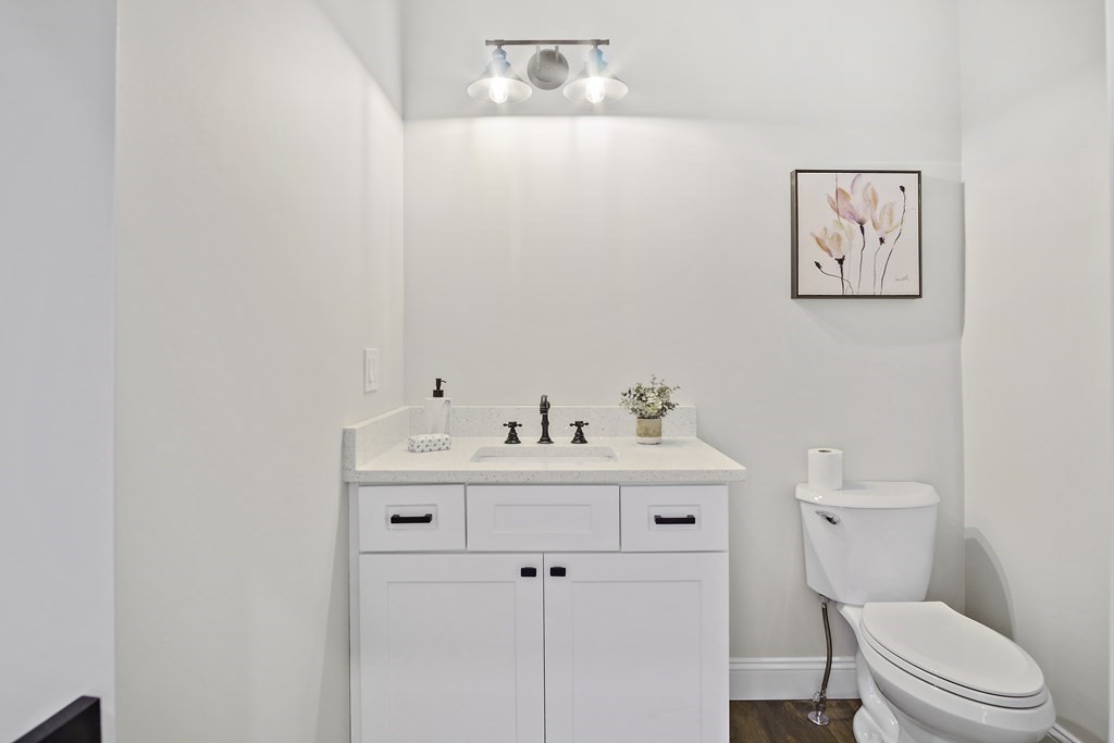 41 Peach Orchard Road Burlington, MA 01803 - Photo 21 of 42 a bathroom with a toilet a sink and mirror