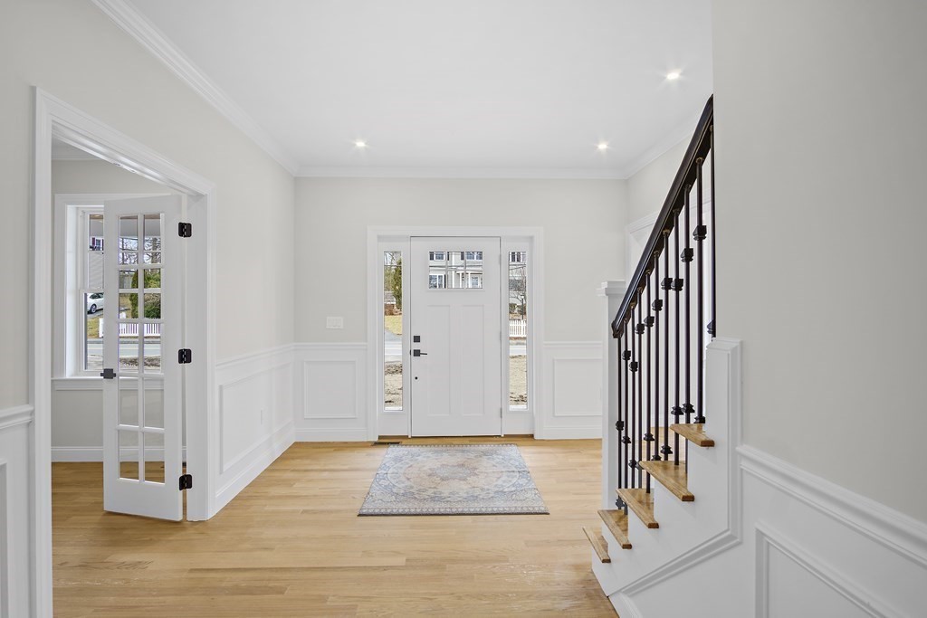 41 Peach Orchard Road Burlington, MA 01803 - Photo 22 of 42 a view of a hallway with wooden floor and staircase