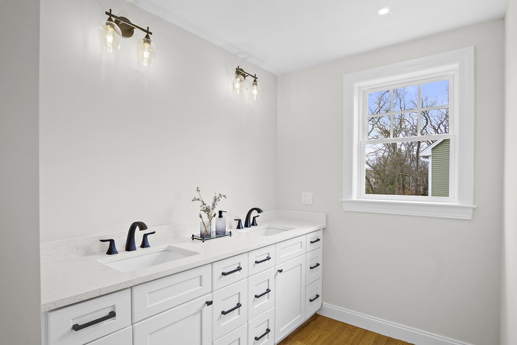 41 Peach Orchard Road Burlington, MA 01803 - Photo 29 of 42 a bathroom with a granite countertop sink mirror and window