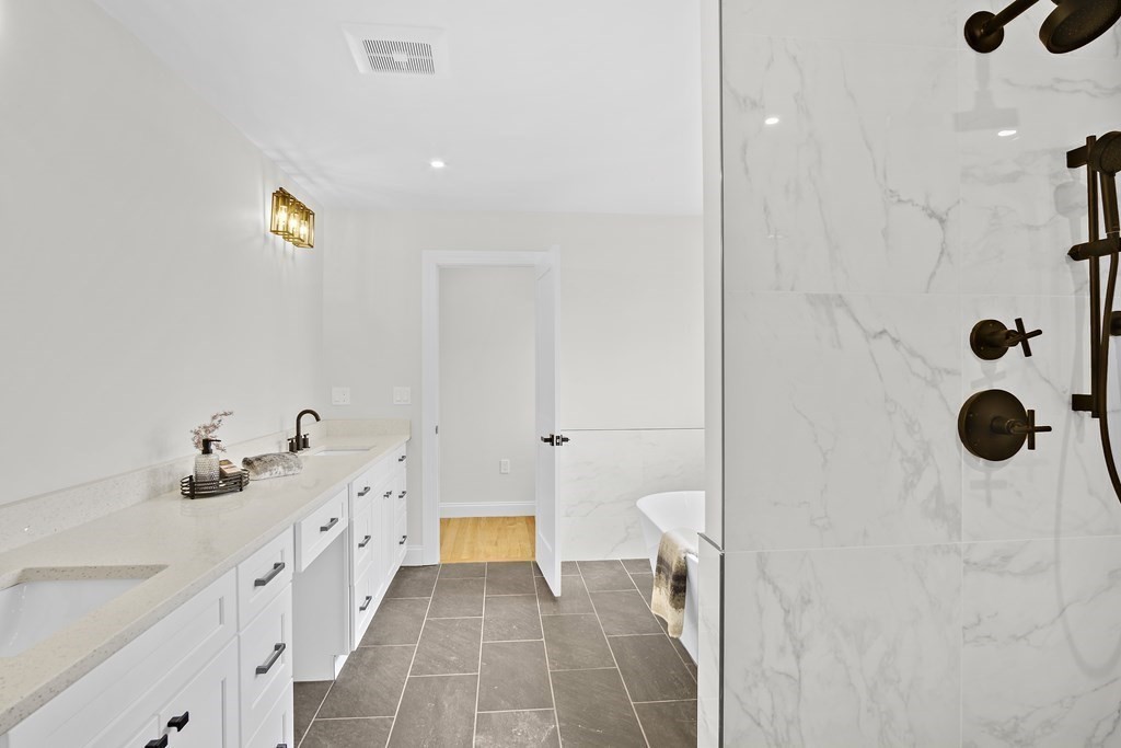 41 Peach Orchard Road Burlington, MA 01803 - Photo 35 of 42 a bathroom with a sink and a shower