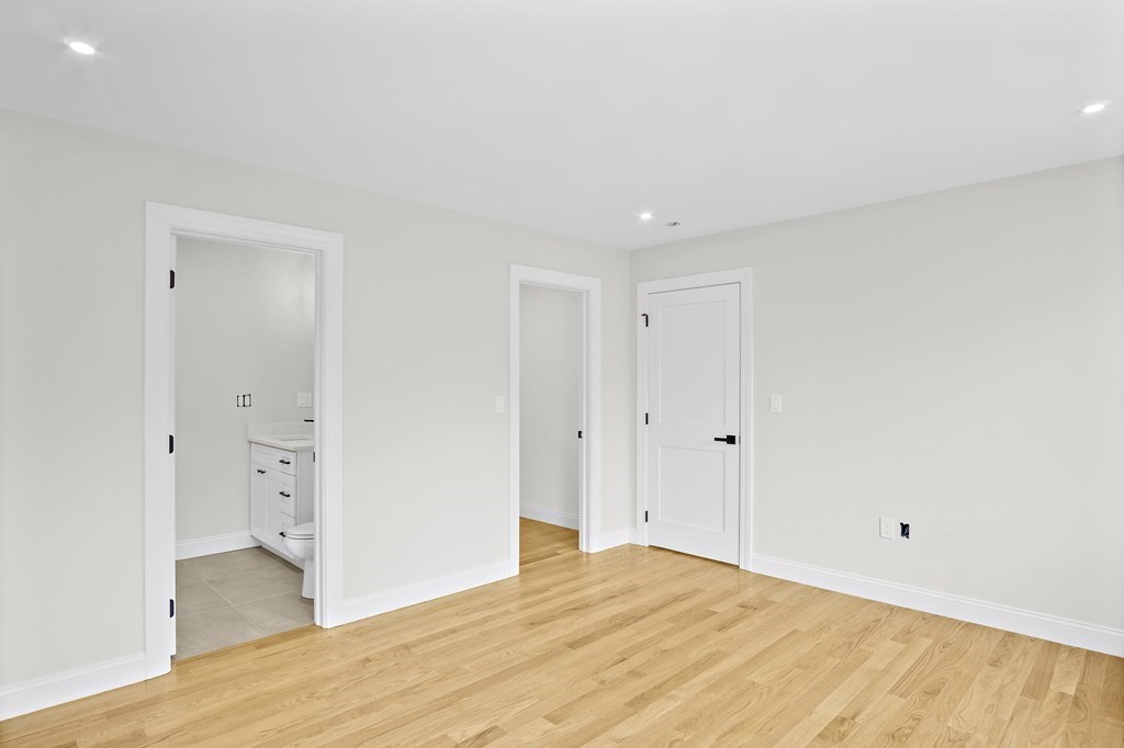 41 Peach Orchard Road Burlington, MA 01803 - Photo 37 of 42 a big room with wooden floor and bathroom view