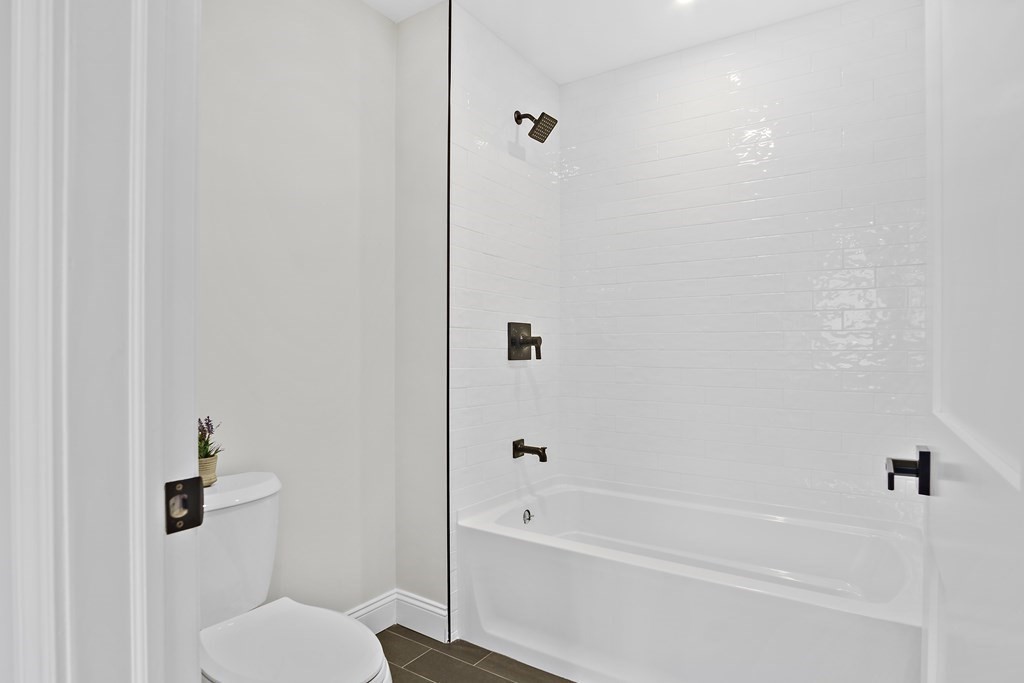 41 Peach Orchard Road Burlington, MA 01803 - Photo 38 of 42 a bathroom with a bathtub and a toilet