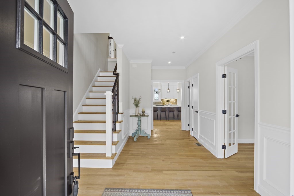 41 Peach Orchard Road Burlington, MA 01803 - Photo 5 of 42 a view of a hallway with wooden floor and entryway