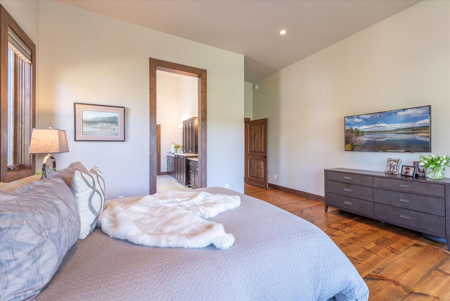 11102 Meek Court Truckee, CA 96161 - Photo 17 of 28 a bedroom with a bed and a flat screen tv