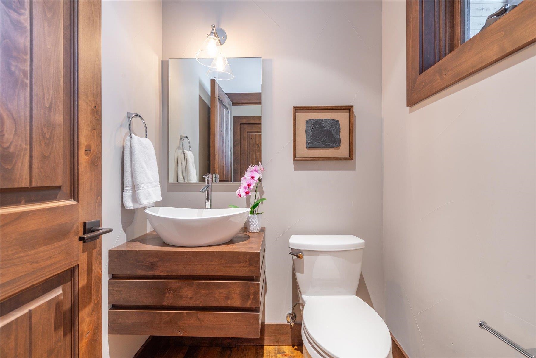 11102 Meek Court Truckee, CA 96161 - Photo 19 of 28 a bathroom with a toilet sink and mirror