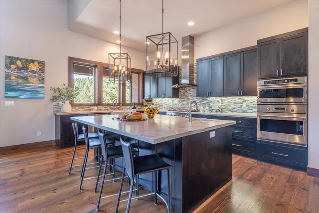 a kitchen with a dining table and chairs