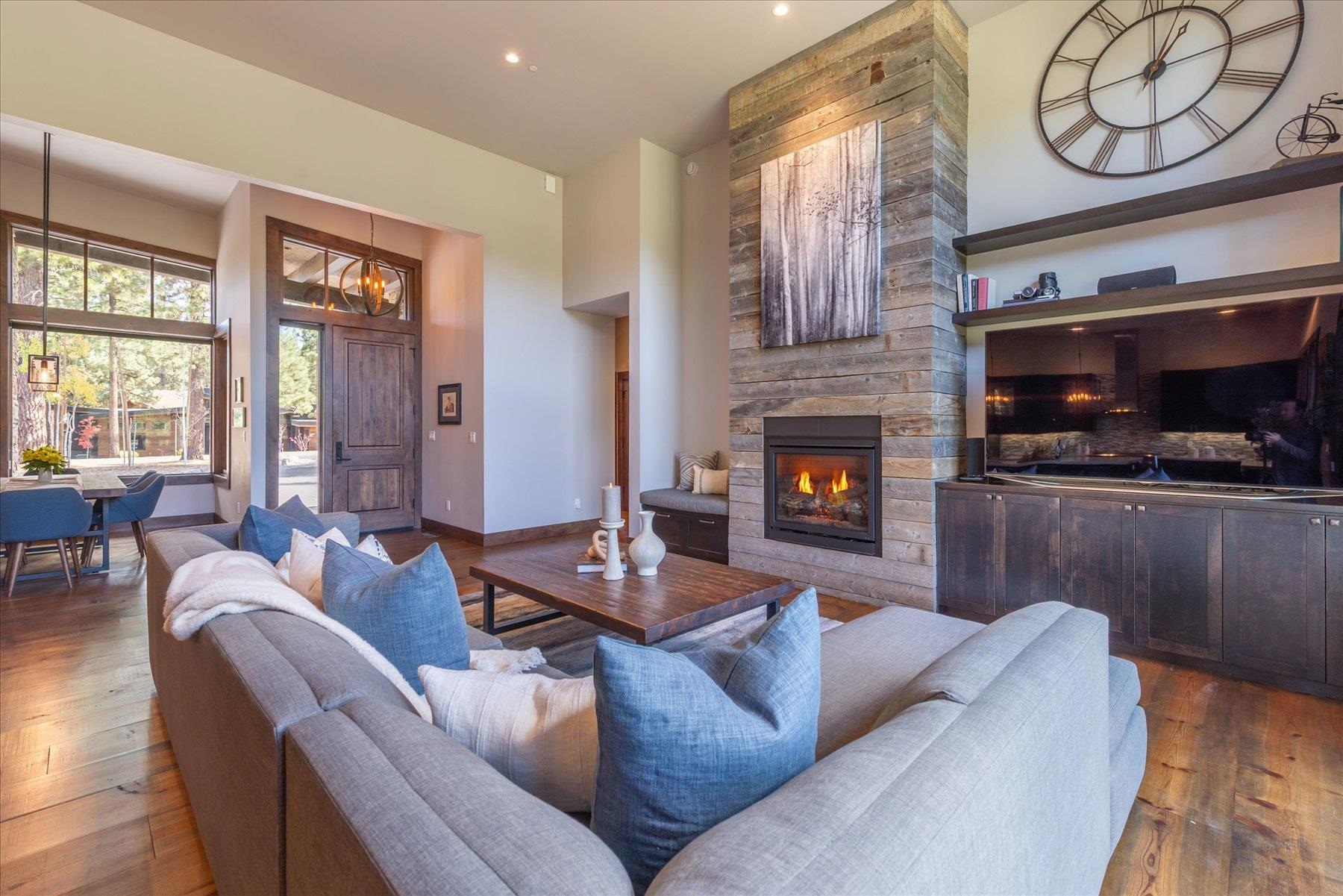 11102 Meek Court Truckee, CA 96161 - Photo 9 of 28 a living room with furniture a fireplace and a flat screen tv