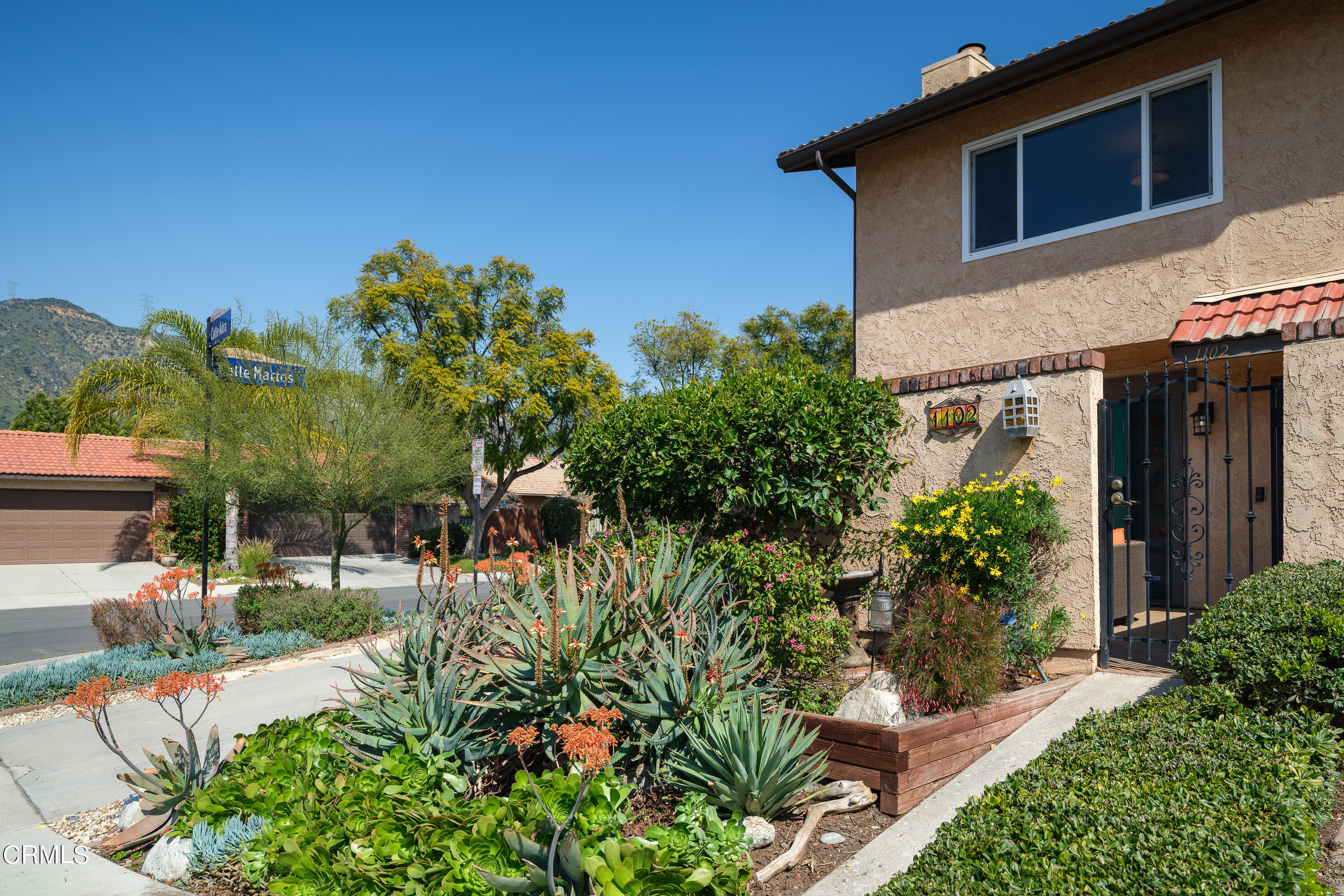 1102 Cll Adra Duarte, CA 91010 - Photo 1 of 37 a view of a house with a yard and potted plants