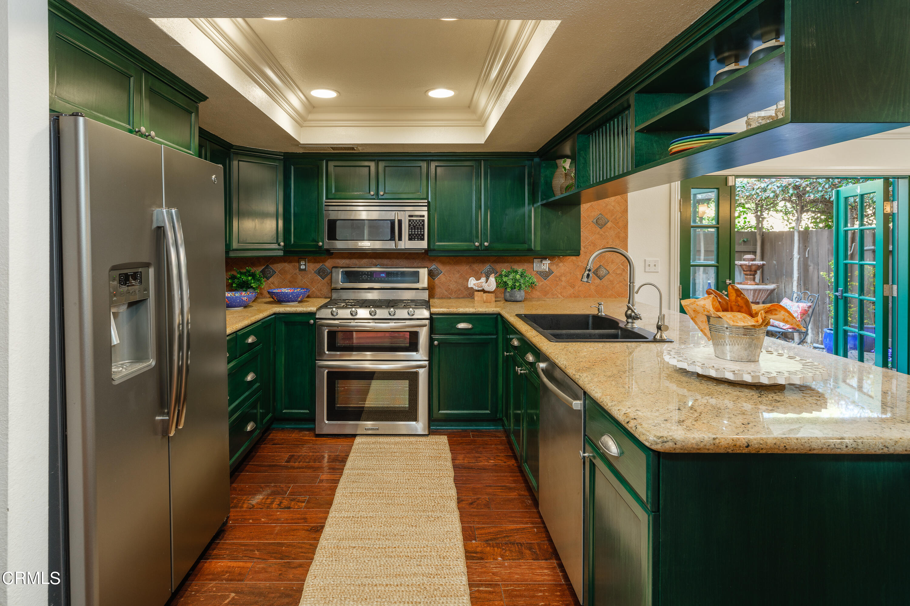 1102 Cll Adra Duarte, CA 91010 - Photo 17 of 37 a kitchen with stainless steel appliances granite countertop a sink stove and refrigerator