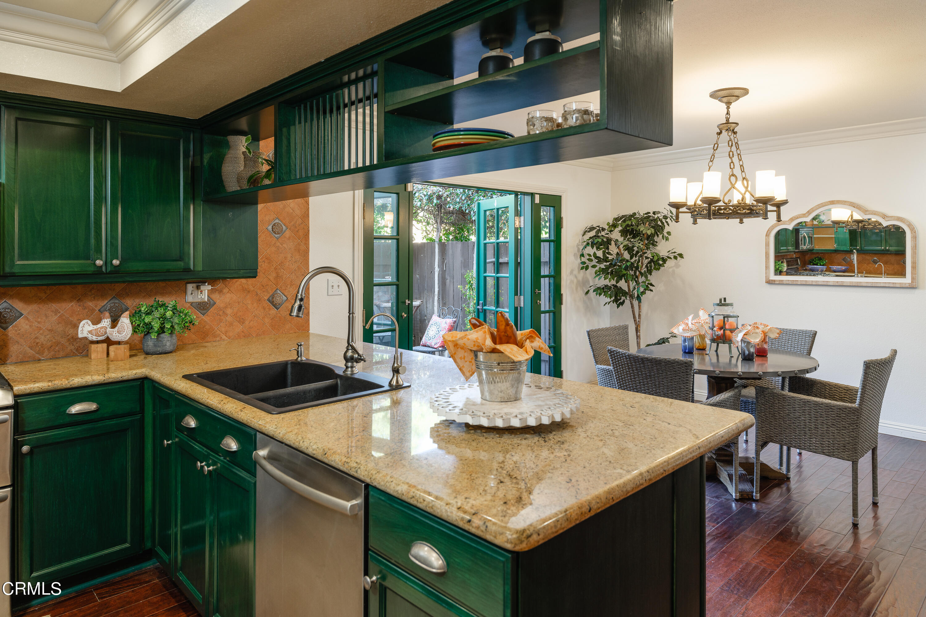 1102 Cll Adra Duarte, CA 91010 - Photo 18 of 37 a kitchen with a sink a counter and chairs in a kitchen
