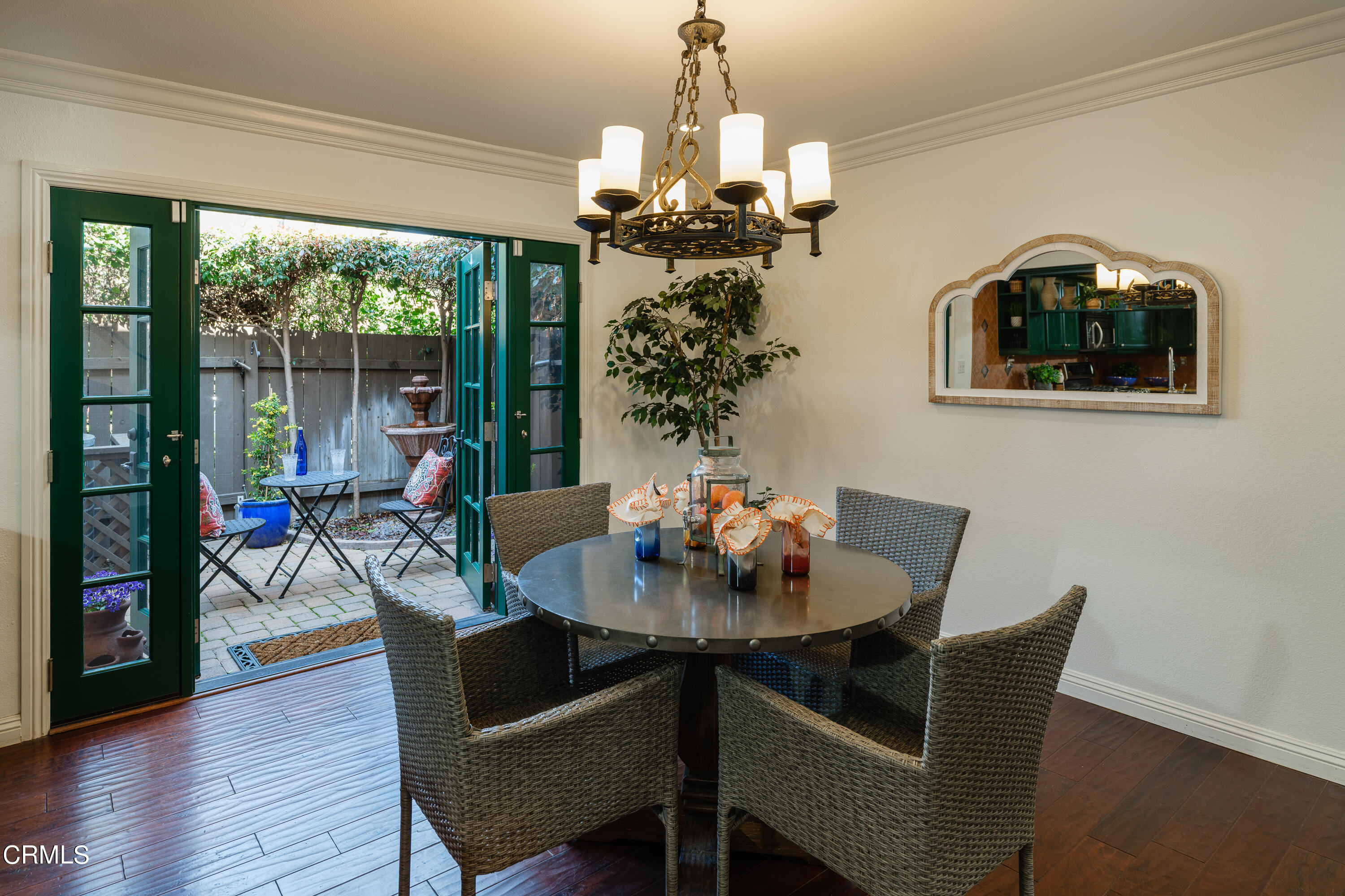 1102 Cll Adra Duarte, CA 91010 - Photo 20 of 37 a dining room with furniture a chandelier and wooden floor