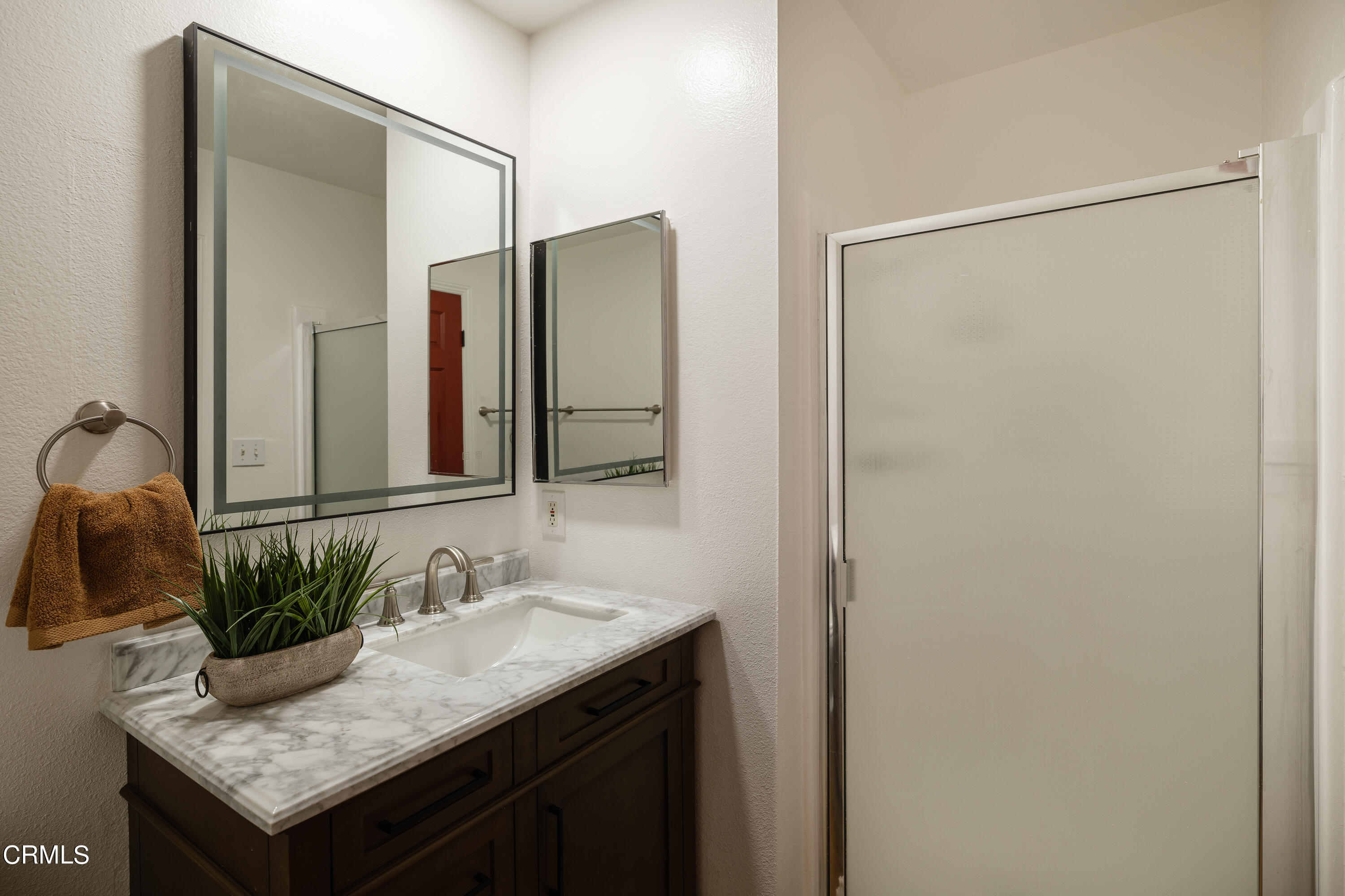 1102 Cll Adra Duarte, CA 91010 - Photo 30 of 37 a bathroom with a granite countertop sink and a mirror