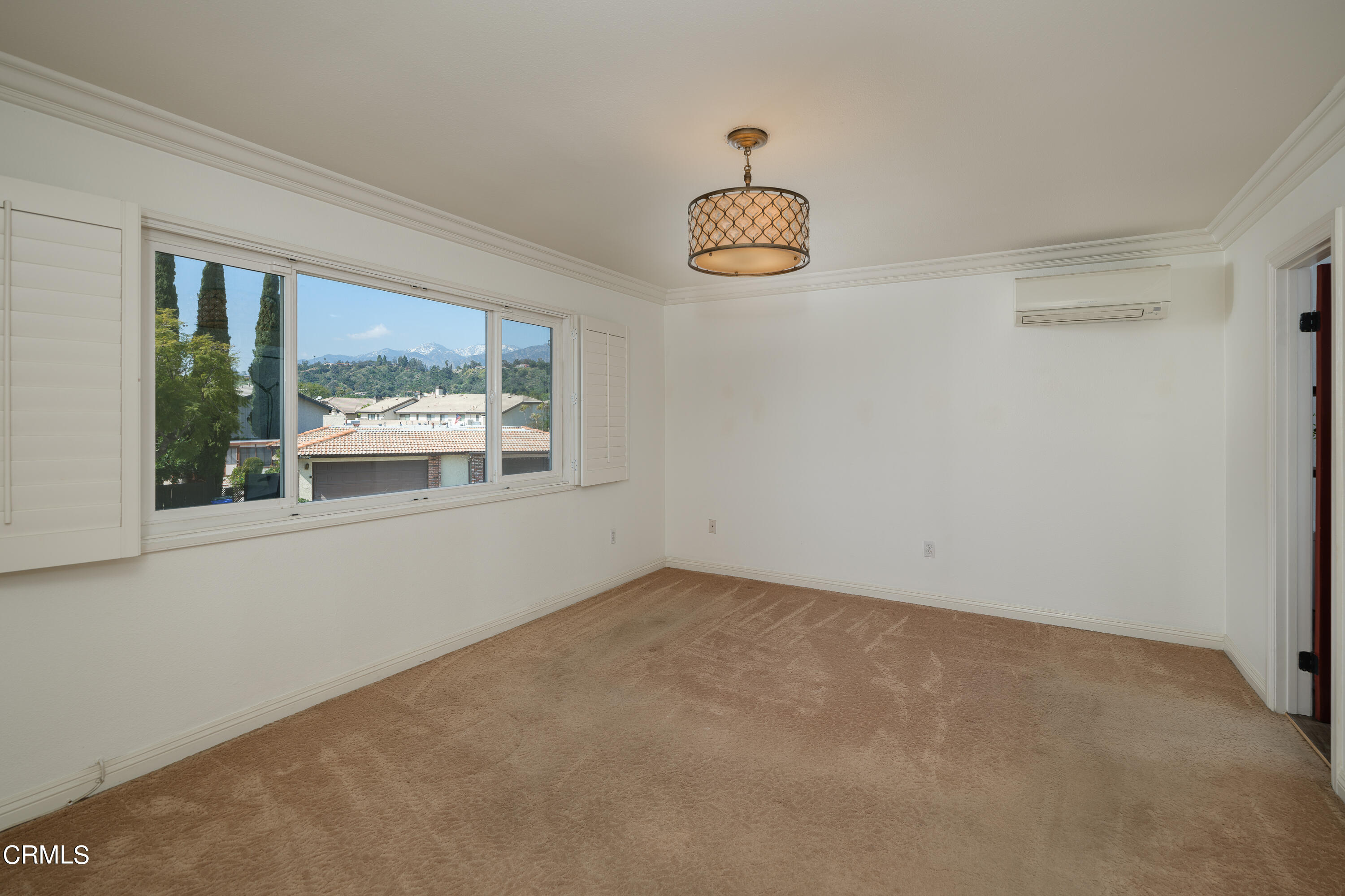 1102 Cll Adra Duarte, CA 91010 - Photo 32 of 37 an empty room with windows and outdoor view