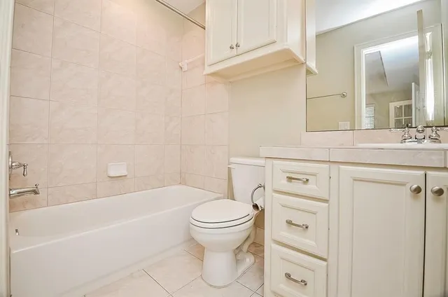 a bathroom with a sink a toilet and a bathtub