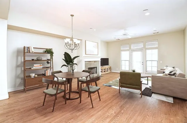 a workspace with furniture window and wooden floor