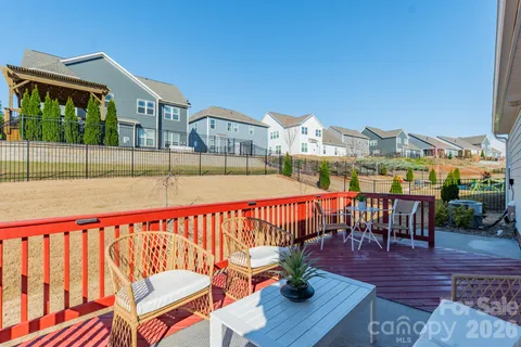 a view of a chairs and table on the deck