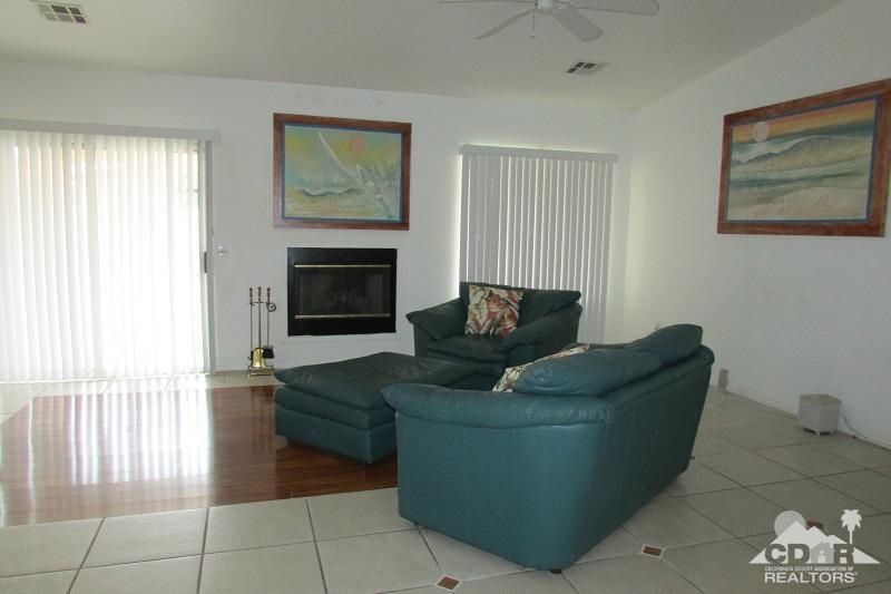 68786 Ocotillo Road Cathedral City, CA 92234 - Photo 11 of 32 a living room with furniture and a fireplace