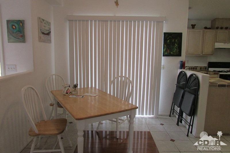 68786 Ocotillo Road Cathedral City, CA 92234 - Photo 12 of 32 a dining room with furniture and a window