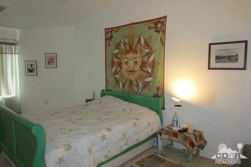 68786 Ocotillo Road Cathedral City, CA 92234 - Photo 16 of 32 a bedroom with a bed and a window