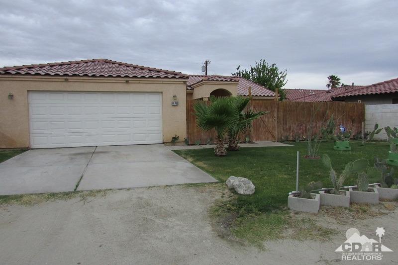 68786 Ocotillo Road Cathedral City, CA 92234 - Photo 2 of 32 a front view of a house with garden