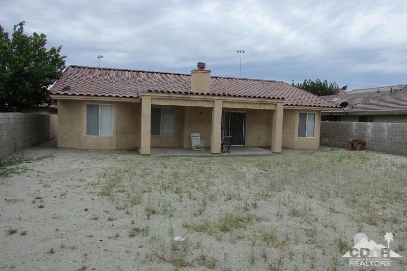 68786 Ocotillo Road Cathedral City, CA 92234 - Photo 21 of 32 a front view of a house with a yard