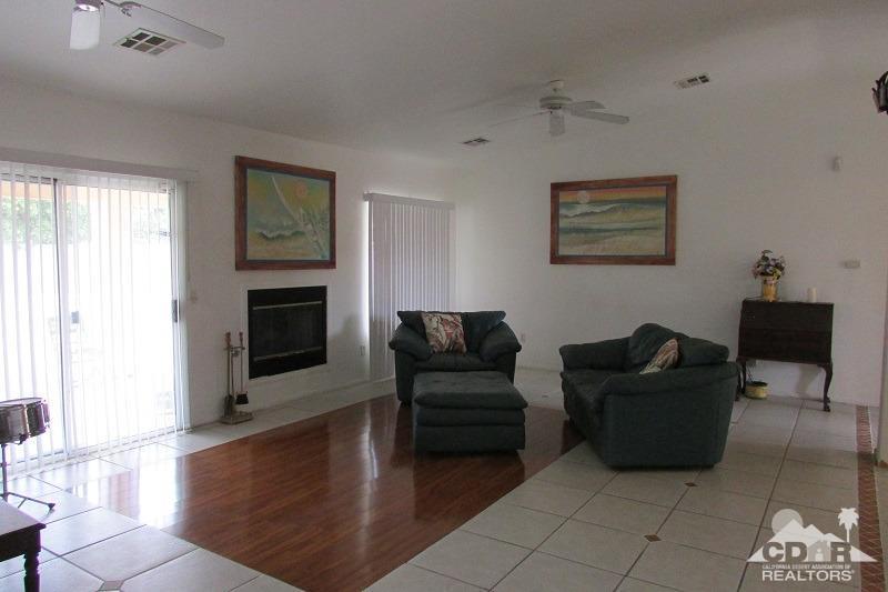 68786 Ocotillo Road Cathedral City, CA 92234 - Photo 5 of 32 a living room with furniture and a fireplace