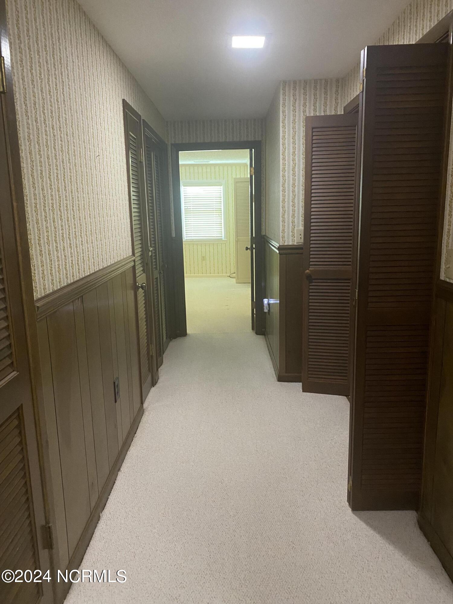294 Pasture Branch Road Rose Hill, NC 28458 - Photo 18 of 23 hall leading to laundry/master suite