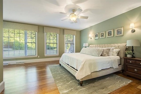 23 Pope Road Atkinson, NH 03811 - Photo 20 of 40 a spacious bedroom with a large bed and a large window