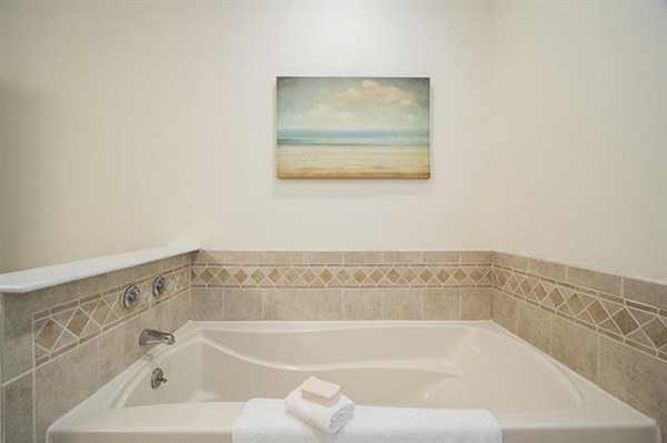 23 Pope Road Atkinson, NH 03811 - Photo 23 of 40 a white bath tub sitting next to a white sink and vanity