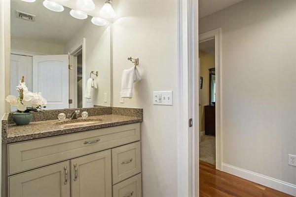 23 Pope Road Atkinson, NH 03811 - Photo 26 of 40 a bathroom with a granite countertop sink and a mirror