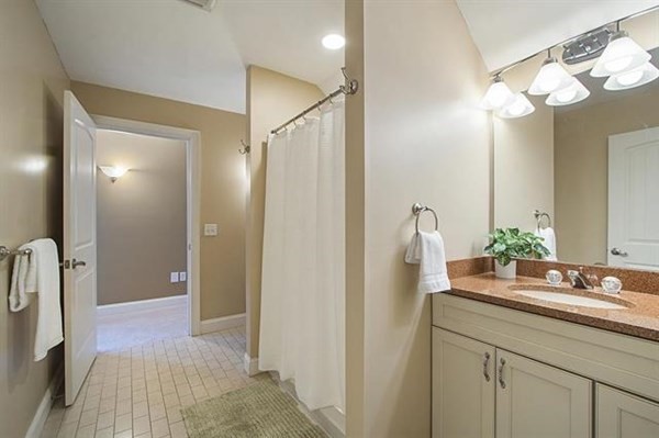 23 Pope Road Atkinson, NH 03811 - Photo 30 of 40 a bathroom with a sink a light fixture and a mirror