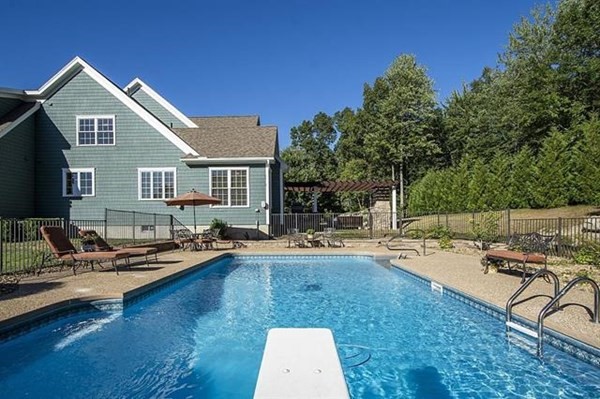 23 Pope Road Atkinson, NH 03811 - Photo 39 of 40 a view of a house with swimming pool and sitting area