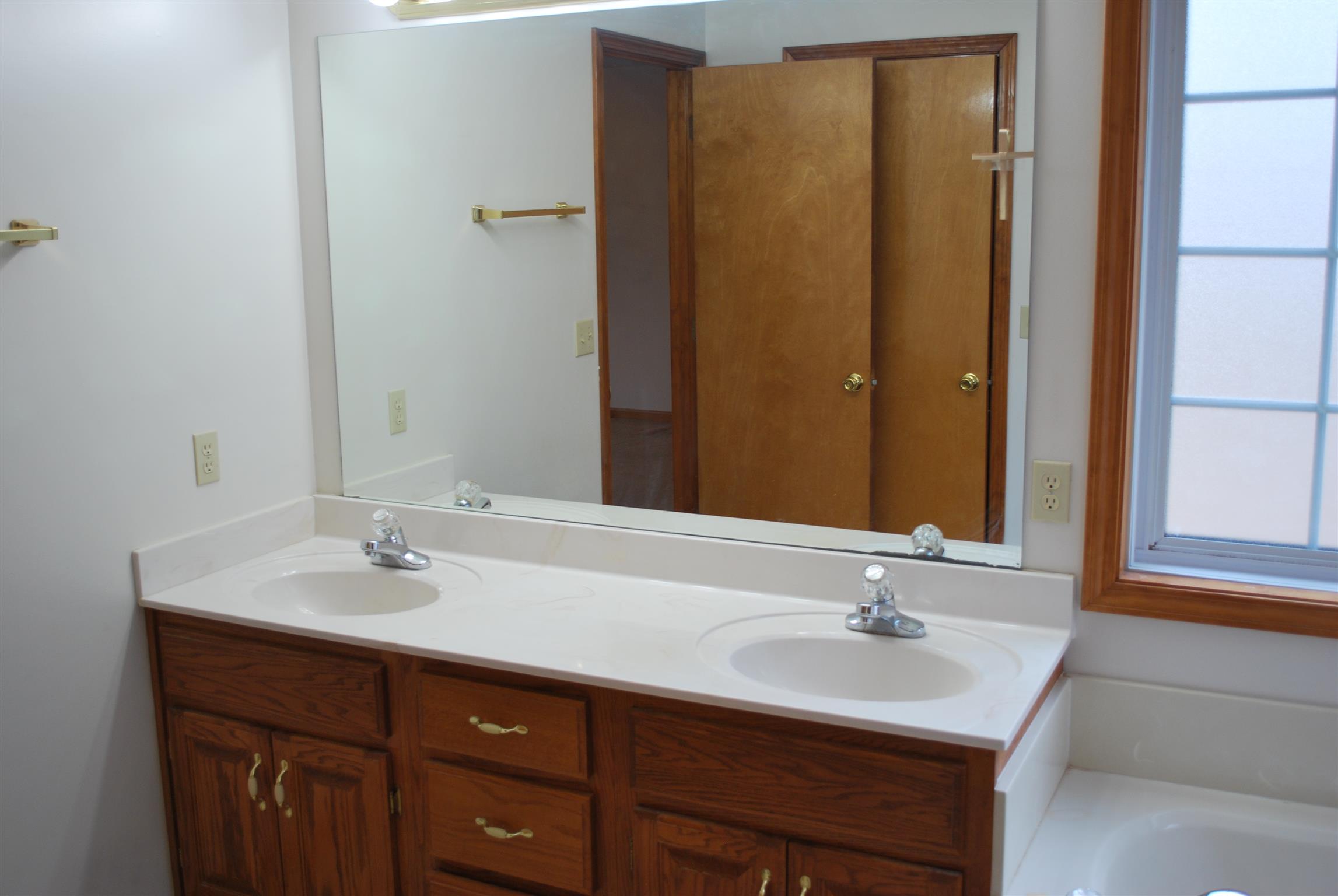 5569 Keysburg Road Adams, TN 37010 - Photo 23 of 30 a bathroom with a sink and a mirror