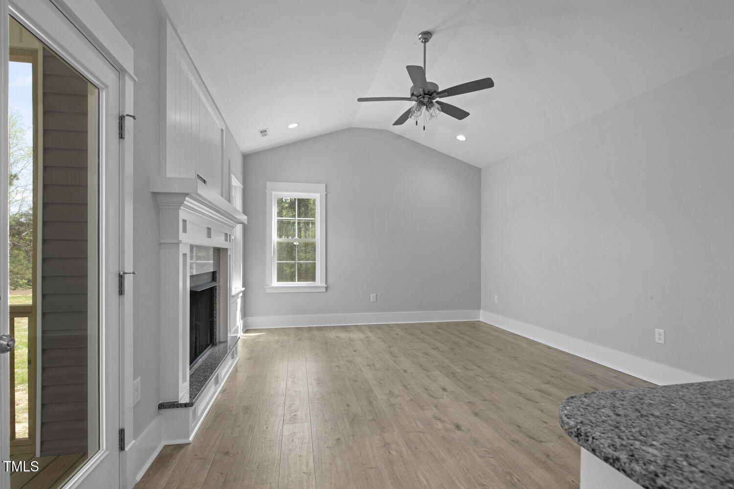 163 South Harper Faith Way Benson, NC 27504 - Photo 20 of 49 a view of empty room with wooden floor and fan