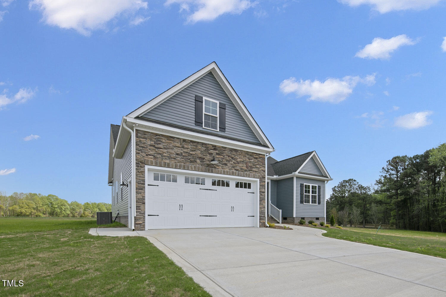 163 South Harper Faith Way Benson, NC 27504 - Photo 3 of 49 a front view of a house with a yard