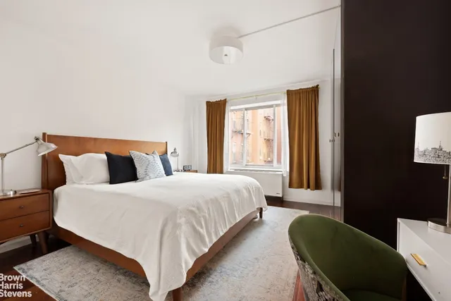 a kitchen with granite countertop a sink stove and cabinets