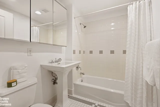 a bedroom with bed and window