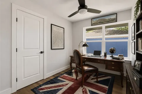 a work room with furniture and windows