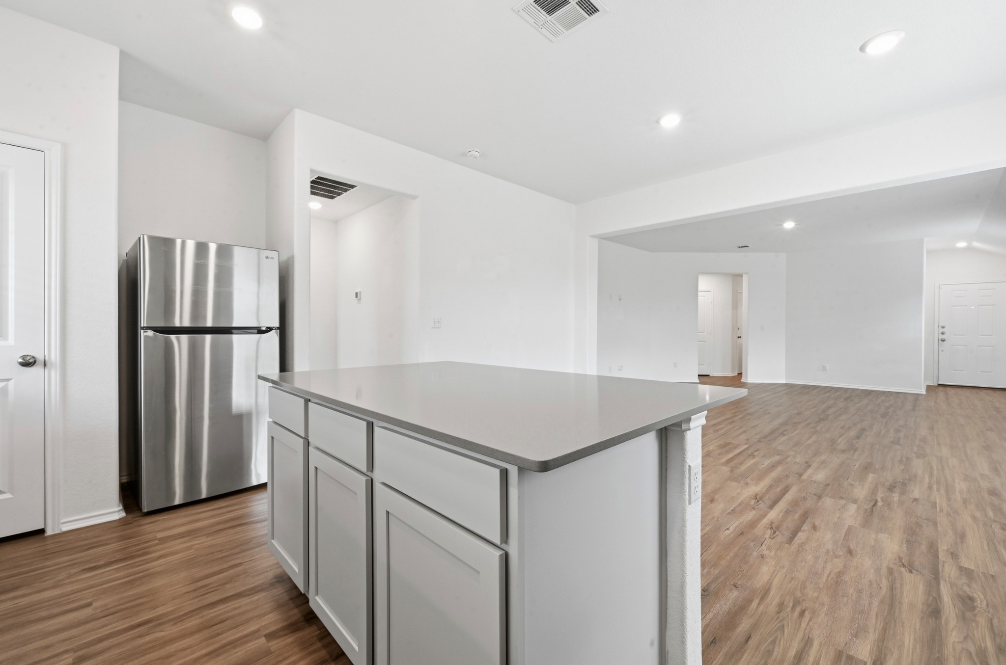 388 Barcelona Kyle, TX 78640 - Photo 26 of 26 a kitchen with stainless steel appliances granite countertop a refrigerator and a stove top oven