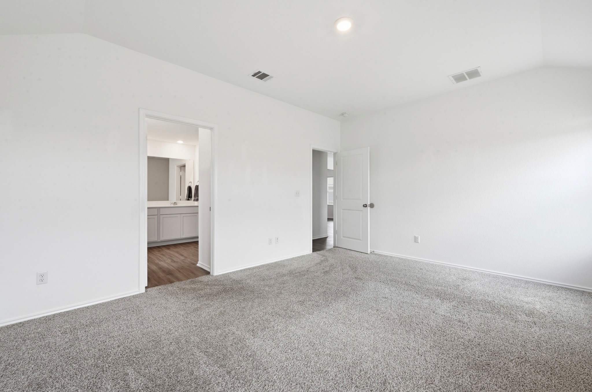 388 Barcelona Kyle, TX 78640 - Photo 13 of 26 a view of an empty room with a kitchen