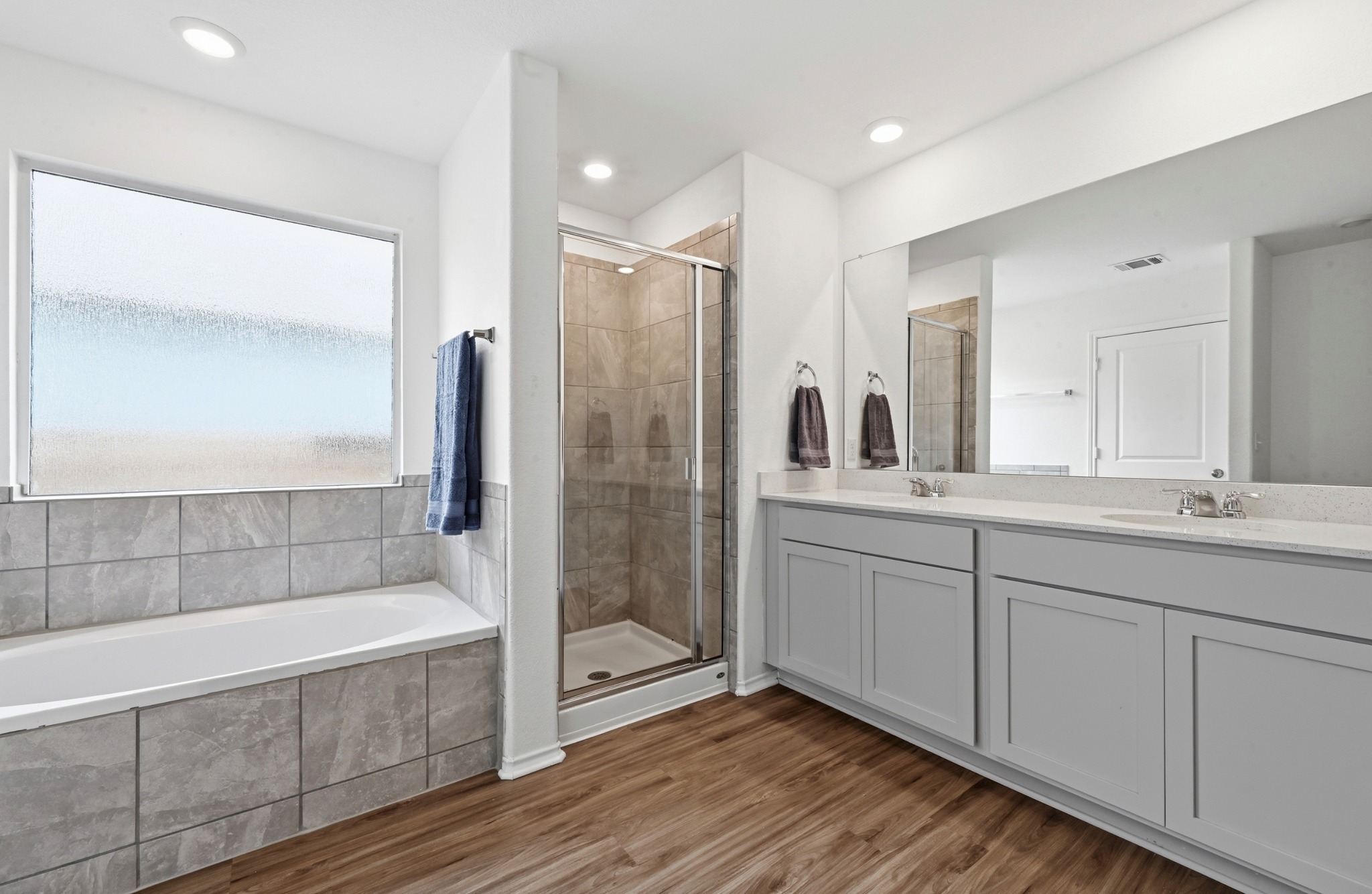 388 Barcelona Kyle, TX 78640 - Photo 15 of 26 a bathroom with a tub shower and sink