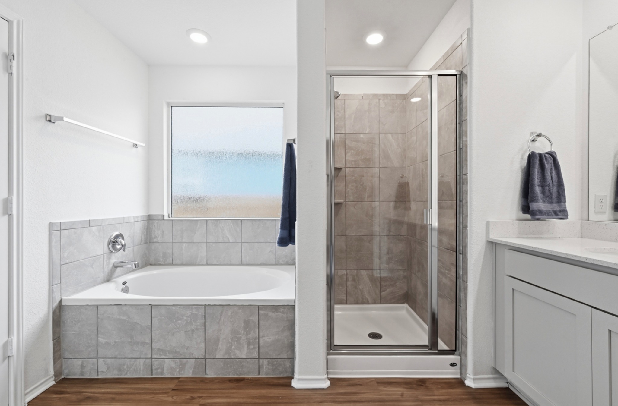 388 Barcelona Kyle, TX 78640 - Photo 16 of 26 a bathroom with a tub shower sink and mirror