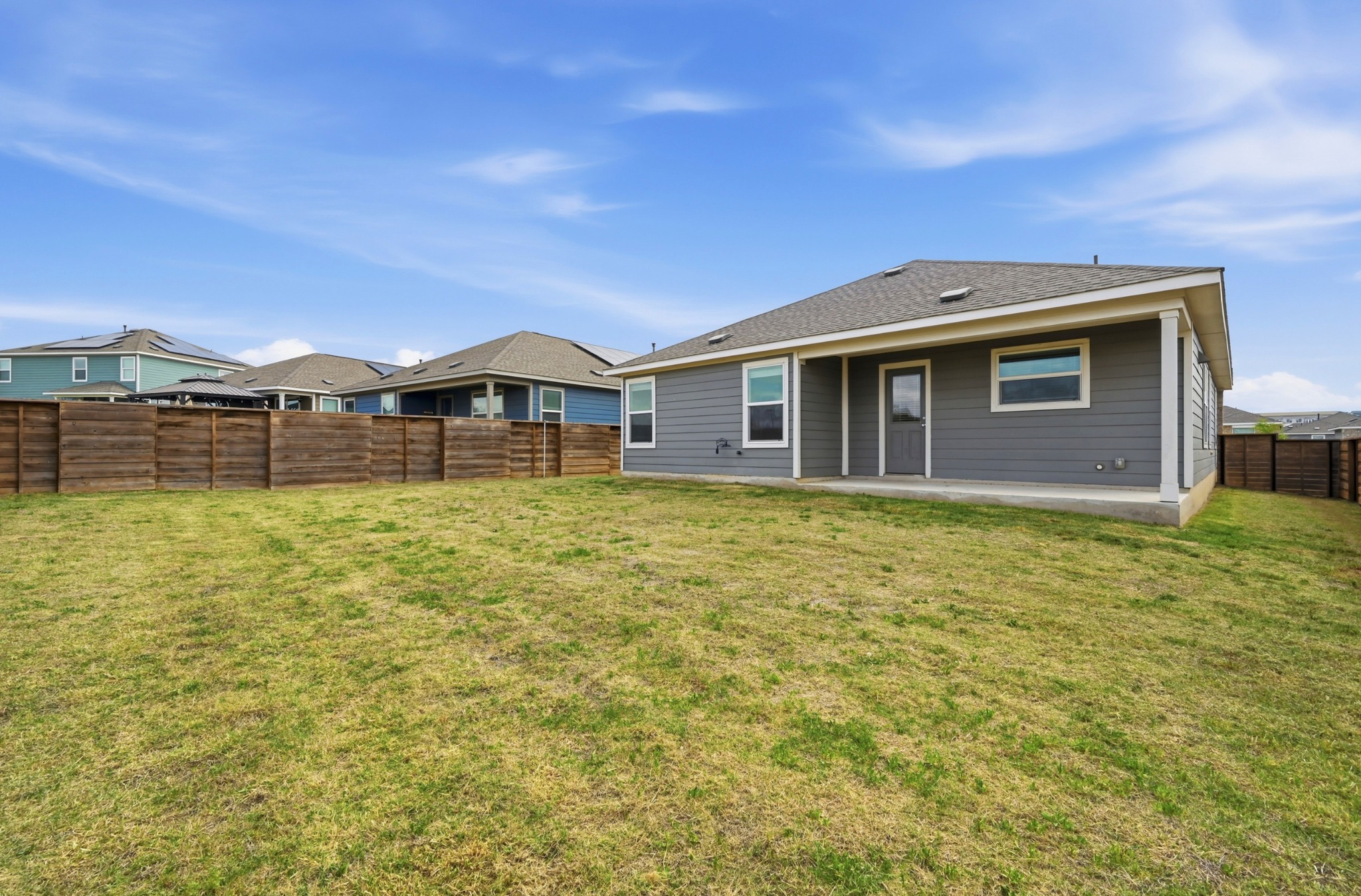 388 Barcelona Kyle, TX 78640 - Photo 22 of 26 a front view of a house with a yard